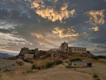 a small chapel in greece with clouds aboveのeditorial素材