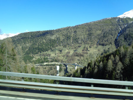 View from the car window on the road to the Alps mountains.の写真素材