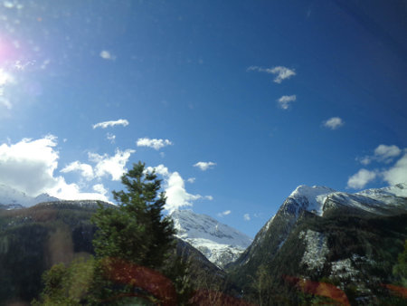 Mountain landscape. Snow-capped mountains and blue sky.の写真素材