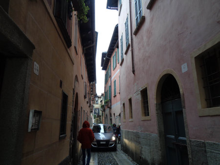 Narrow street in the old town of Lucca, Tuscanyの写真素材