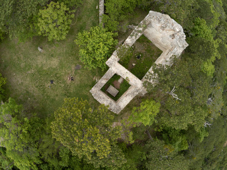 Aerial view of ruins of an old castle in the forest.の写真素材