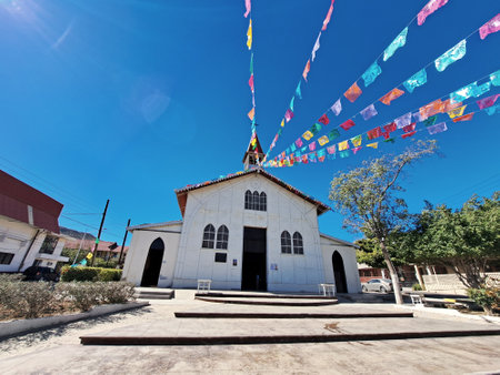 Old church with colorful flags on a sunny day in Bagan, Myanmarの写真素材