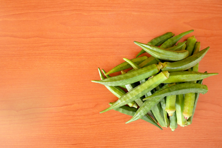 Okra, Ladyâs finger, Gombo, Gumbo, Bendee, Quimbamto on the old woodenの写真素材