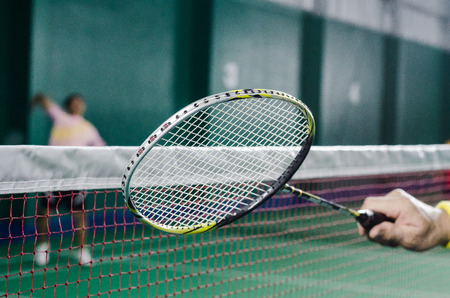 badminton racket on courtの写真素材