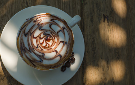 Barista making a cup of coffee soft focus image .