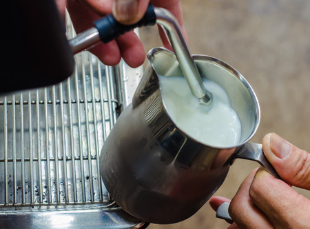 Barista making a cup of coffee soft focus image .の写真素材