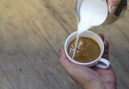 Barista making a cup of coffee soft focus image .の写真素材