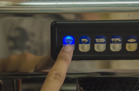 Barista making a cup of coffee soft focus image .
