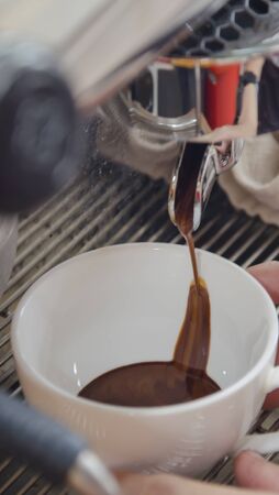 Barista making a cup of coffeeの写真素材