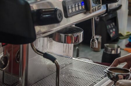 Barista making a cup of coffee soft focus image .の写真素材
