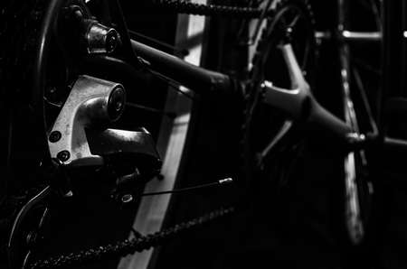 low key black and white silhouette of bicycle black backgroundの写真素材