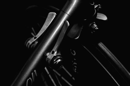 low key black and white silhouette of bicycle black background