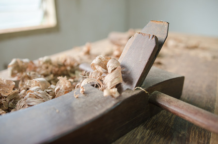 The carpenter was working furniture wood in studio