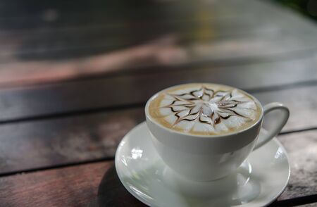 Barista making a cup of coffee soft focus image .