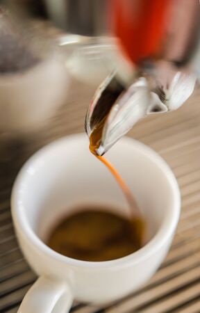 Barista making a cup of coffee soft focus image .の写真素材