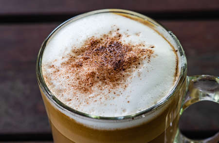 Barista making a cup of coffee soft focus image .