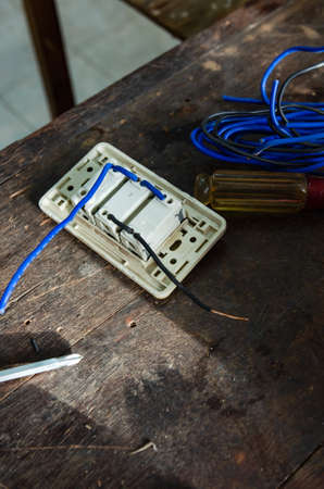 An electrician who is connecting electricity in a residential house.の写真素材