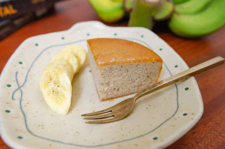 Banana cake on a wooden tableの写真素材