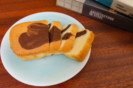 Delicate butter cake on a wooden table, soft focus.の写真素材