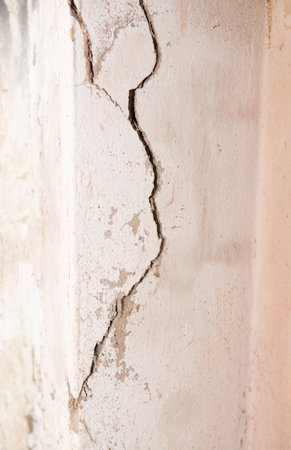Cracked concrete walls, cracks in the structure of the house