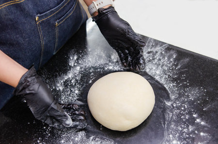 Making bread in the kitchen by a baker