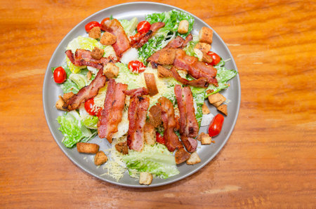 Salad with bacon and cheese and Caesar dressingの写真素材