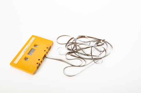 An old cassette tape on a white backgroundの写真素材