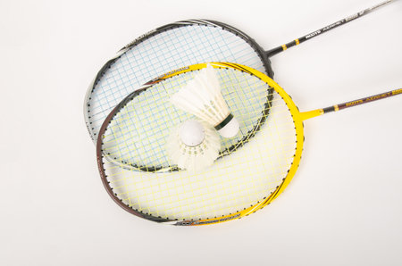 shuttlecocks with a racket on a white backgroundの写真素材