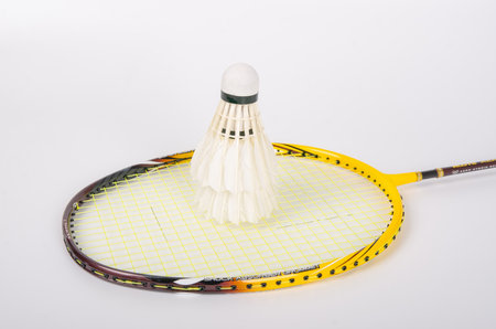 shuttlecocks with a racket on a white backgroundの写真素材