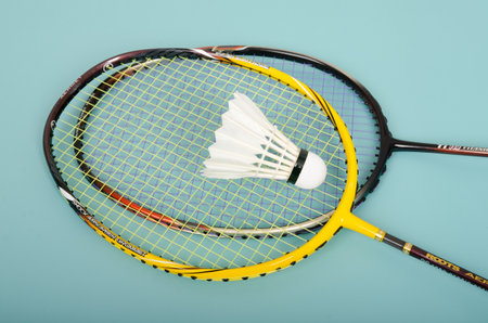 shuttlecock on badminton racket on colored paper backgroundの写真素材