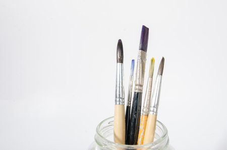 Watercolor brushes in a glass jarの写真素材