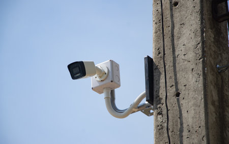 CCTV surveillance security camera video equipment on pole outdoor building safety system area...