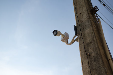 CCTV surveillance security camera video equipment on pole outdoor building safety system area...