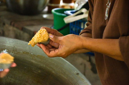 Asian man making boiled palm coconut sugar or cane production process  raw material  Amphawa  Thailand. Traditional culture lifestyle. Local sweet food.の写真素材