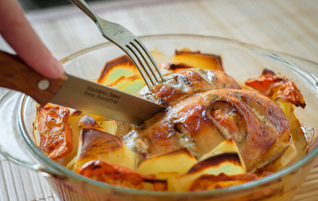 Baked chicken breast with potatoesの写真素材