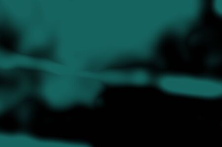 abstract blurred green dark and black colors gloomy background for design.の写真素材