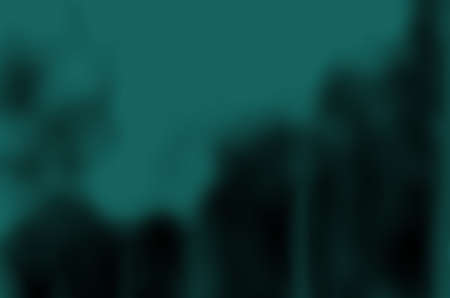 abstract blurred green dark and black colors gloomy background for design.の写真素材