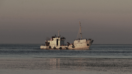 An old fishing boat in the bay.