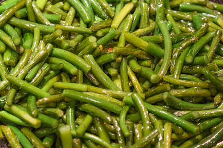 Ground garlic stalks fried in oil. Asian food.の写真素材