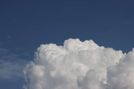 Flyffy white cumulus clouds seen from above