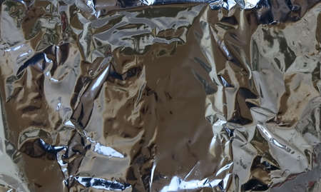 Background, surface texture of crumpled metal foil.の写真素材