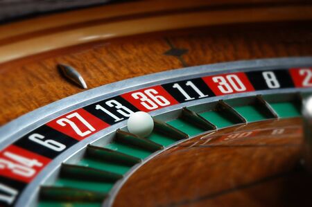 Roulette wheel with ball in thirteen slotの写真素材