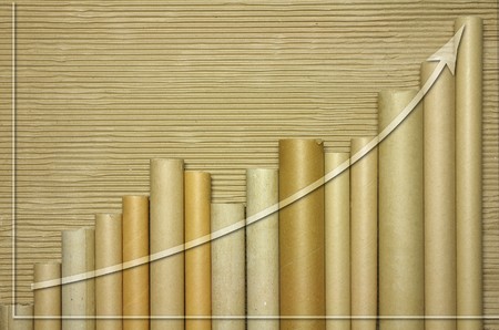 cardboard tubes showing graph with upward trendの写真素材
