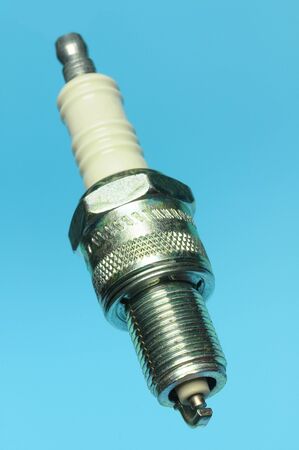 spark plug from a car isolated on blue