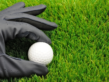 close up of golf glove and golf ballの写真素材