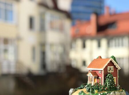 ceramic model house outdoors on the background of real housesの写真素材