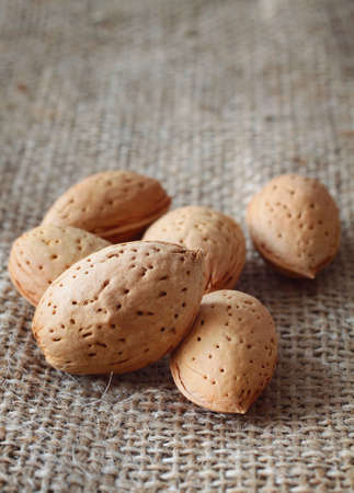 Almonds over rustic backgroundの写真素材