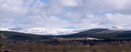 panoramic shot of snow covered mountans in the Highlands of Scotlandの写真素材