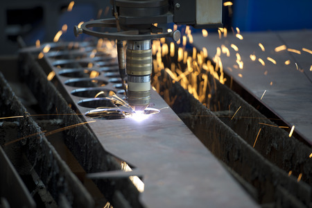 Industrial laser making holes in metal sheet