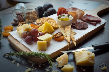 Cheese and Coldcuts on Wooden Boardのeditorial素材